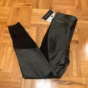 NWT Koral leggings. Gray (shiny) and black. Size medium.
